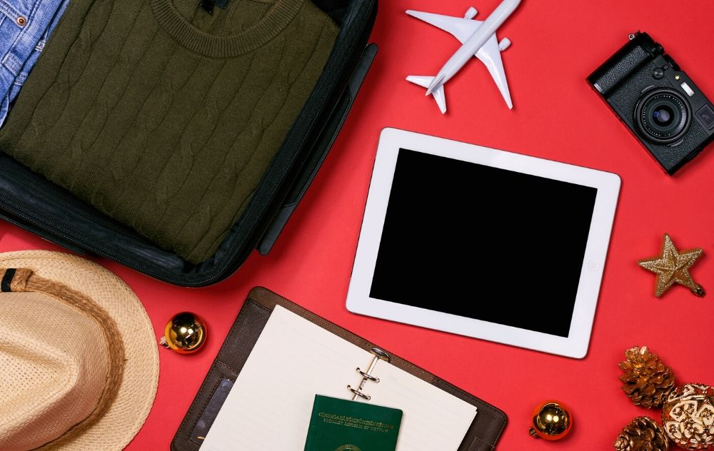 Traveling for the holidays with varicose veins. how to manage the symptoms of varicose veins when traveling for the holidays. Image showing some of the items that may be included when traveling for the holidays.