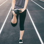vein facts you thought were true, but aren't. Blog article cover depicting woman stretching before she goes running.