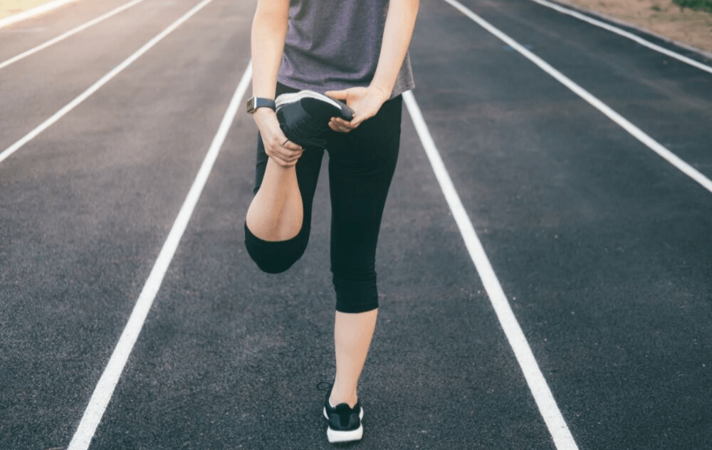 vein facts you thought were true, but aren't. Blog article cover depicting woman stretching before she goes running.