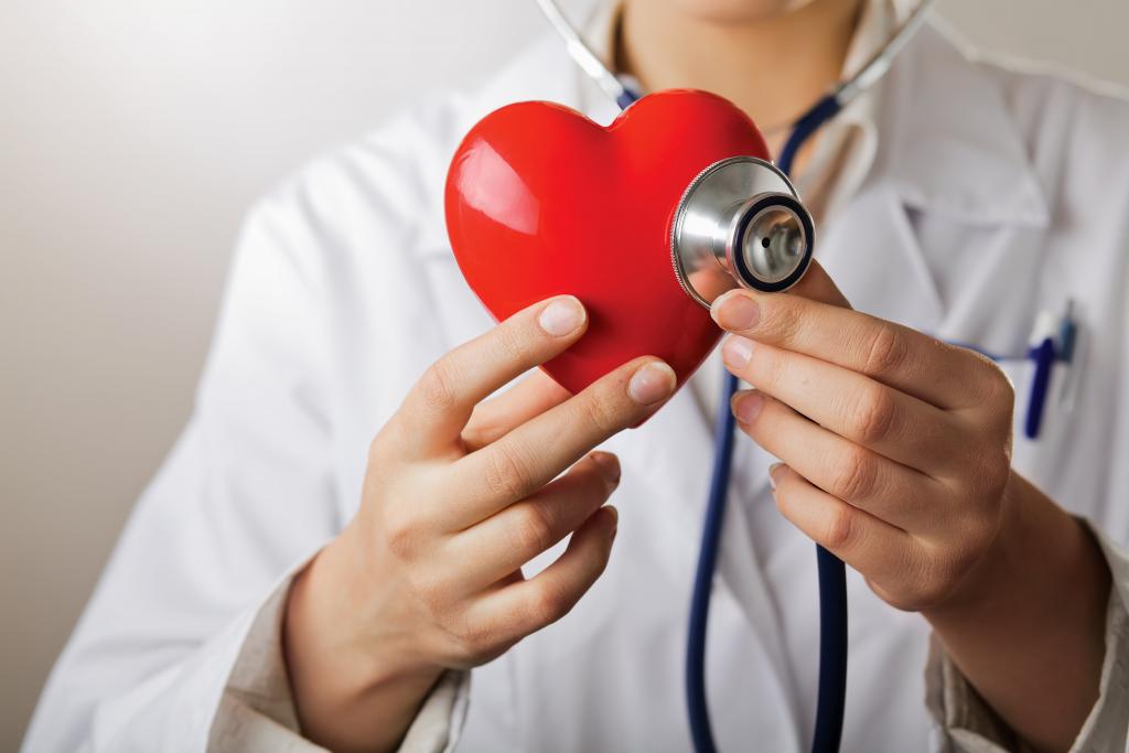 Doctor Uses Stethoscope on Red Heart