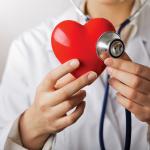 Doctor Uses Stethoscope on Red Heart