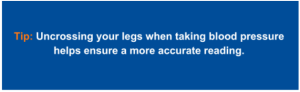 Why should you uncross your legs when taking blood pressure