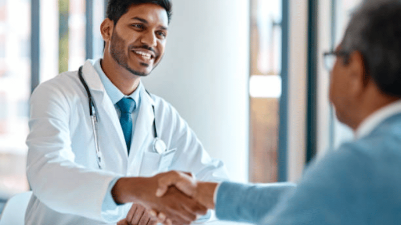 Why It Can Be Painful To Stand If You Have Varicose Veins 7 Patient consulting with a vein specialist about leg pain from varicose veins