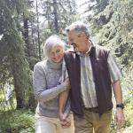 old couple laughing in forest