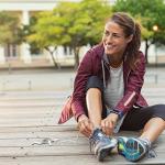 woman putting on her shoes