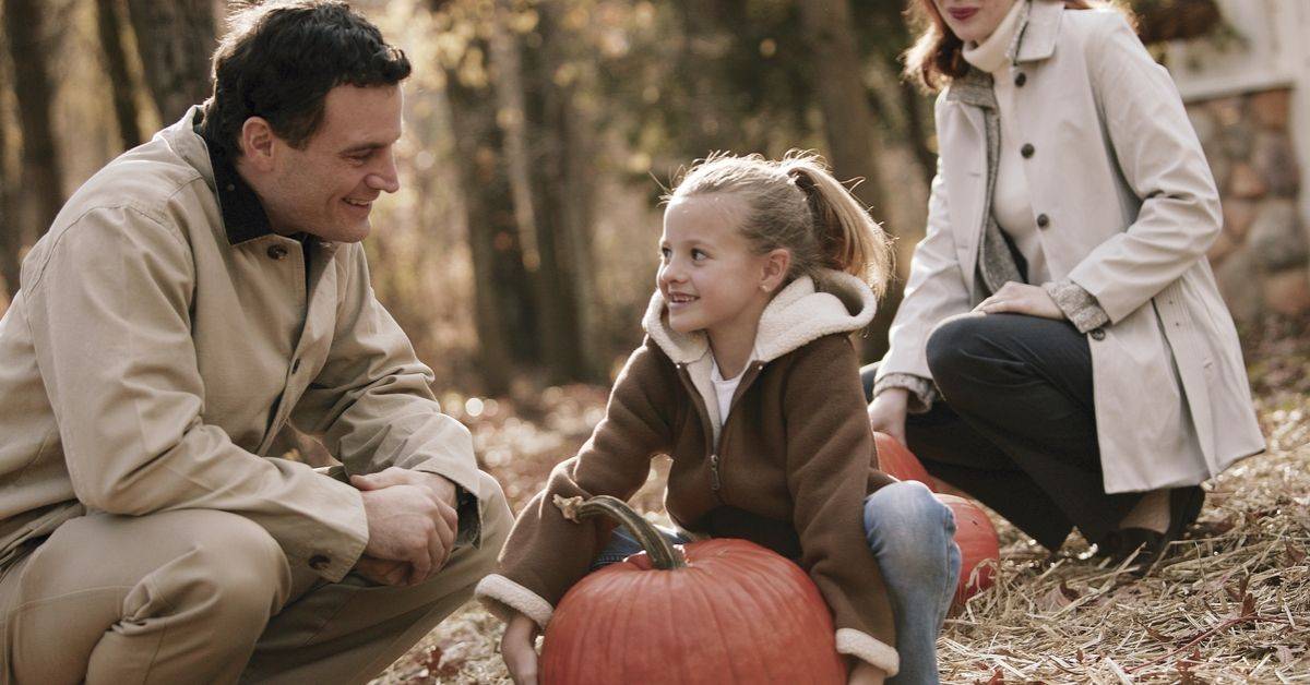 family exercising by picking pumpkins together vein health awareness improve circulation