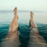 person with legs floating in water