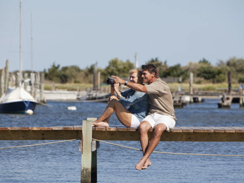 Couple sitting on a dock