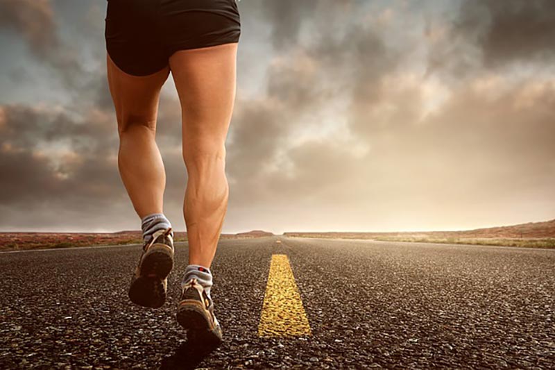 person jogging on a road